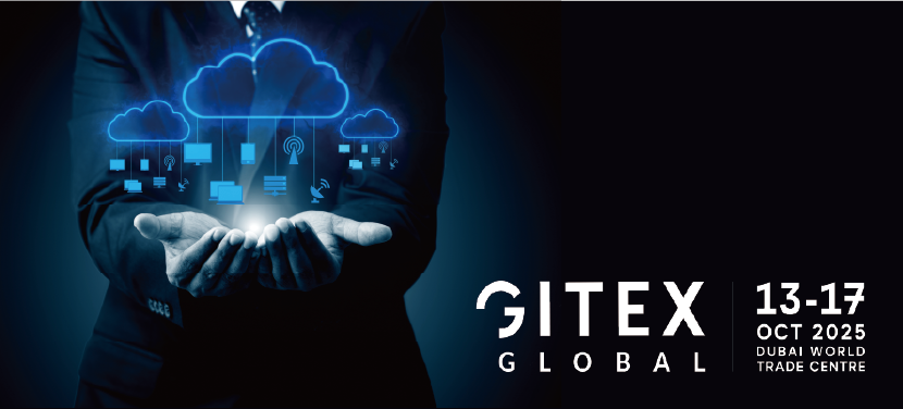 "Businessman holding a glowing cloud computing graphic, symbolizing digital innovation at GITEX Global 2025, taking place October 13–17 at Dubai World Trade Centre."